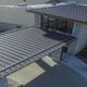 Standing Seam Metal Roof Panels Being Installed