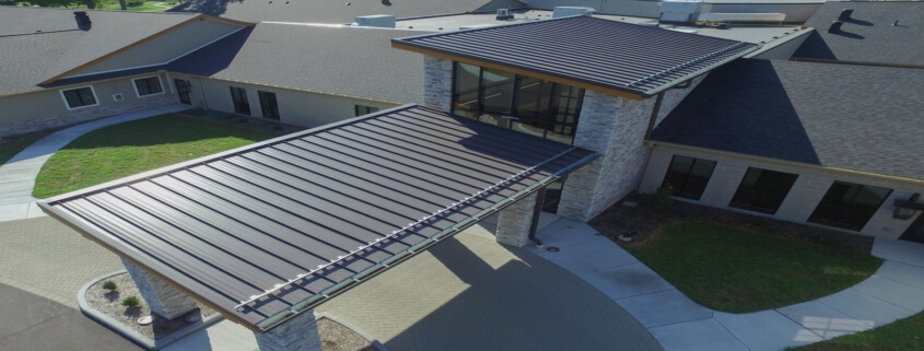 Standing Seam Metal Roof Panels Being Installed