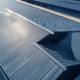 Durable metal roofing installation for a commercial building, offering long-term protection.