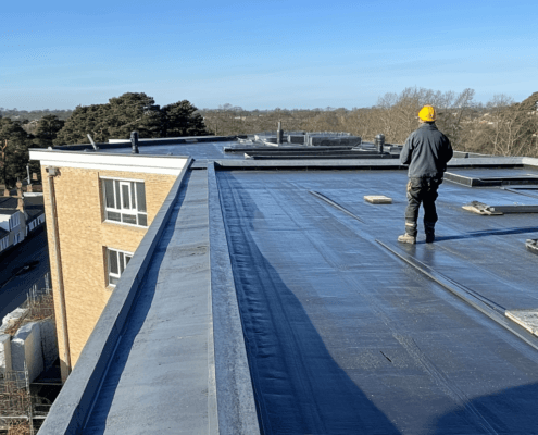 Professional flat roof installation with precise flat roof detail for commercial properties.