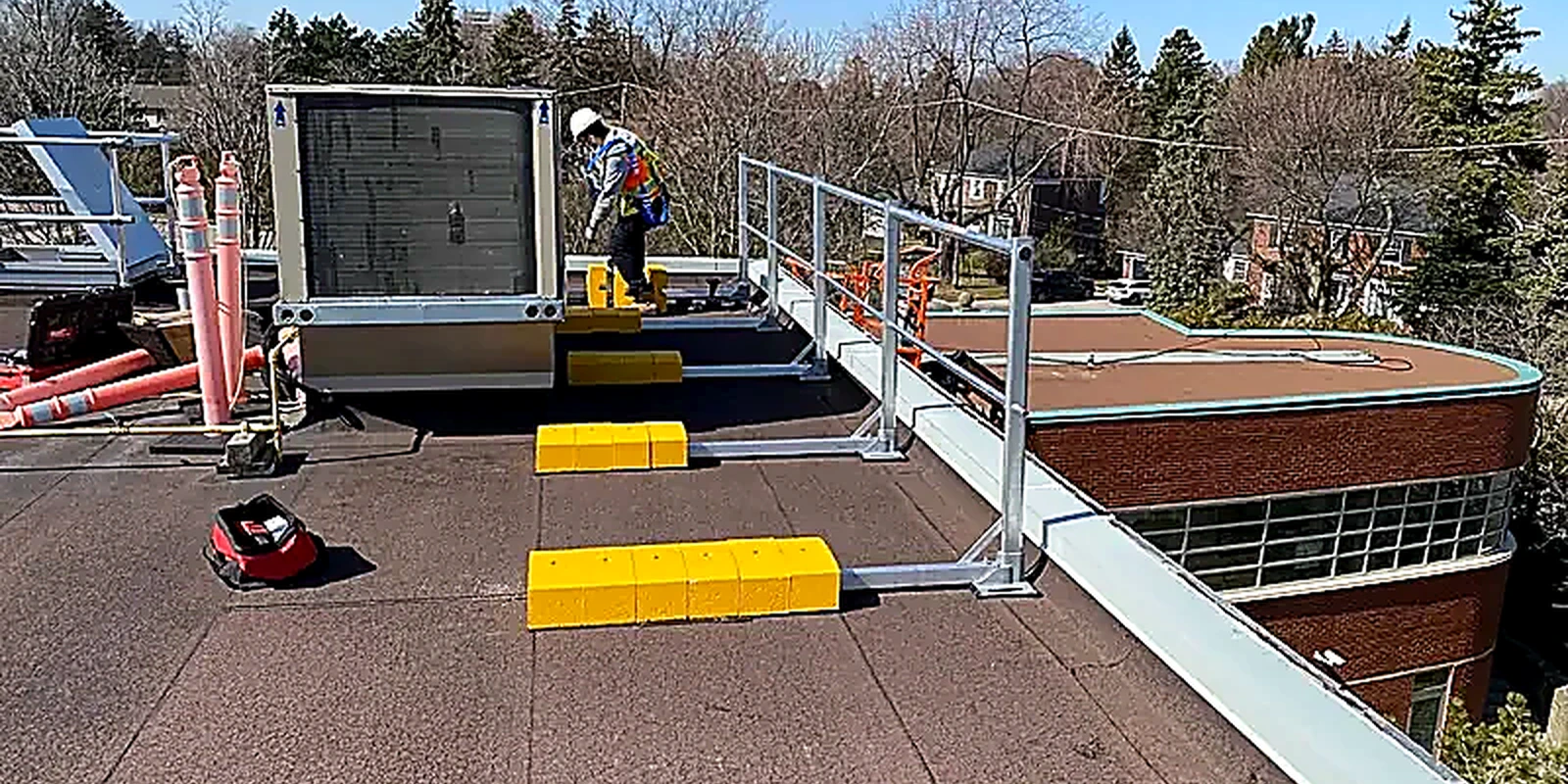 Commercial roof repair work on a low-slope roof