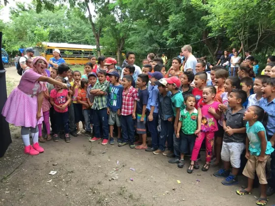 Children and volunteers together in the community.