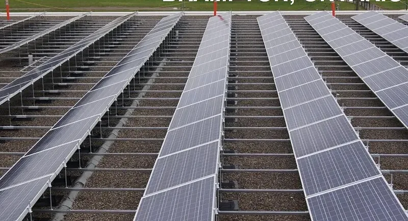Rows of low-tilt photovoltaic modules on a commercial flat roof