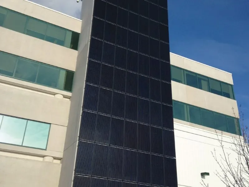 Vertical photovoltaic panels installed on a commercial building facade