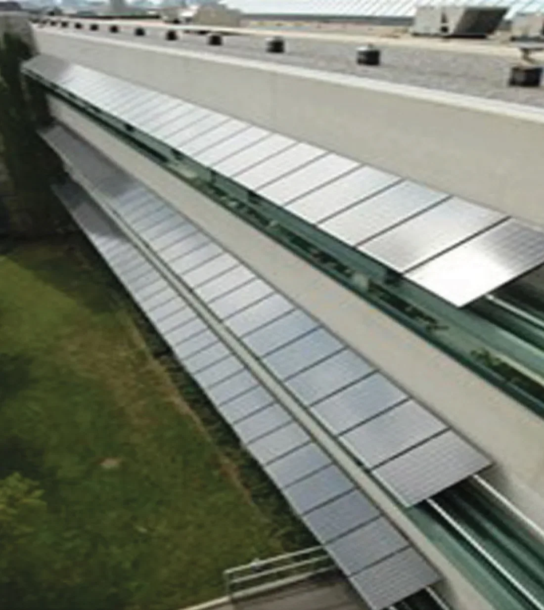 Photovoltaic modules integrated with the exterior of a commercial building