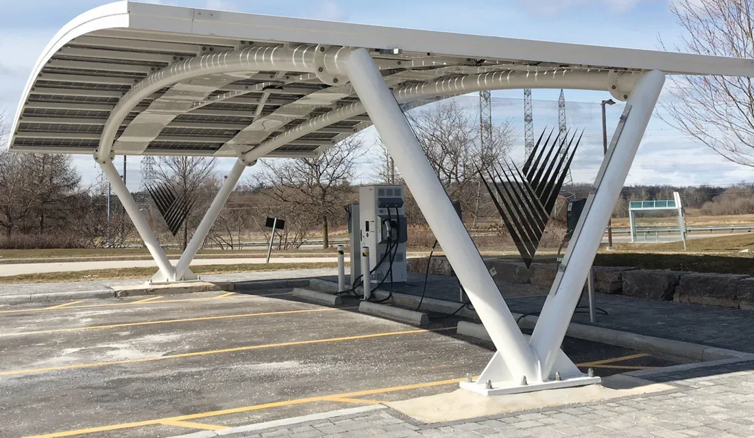 Solar-panel canopy installed above a commercial parking area