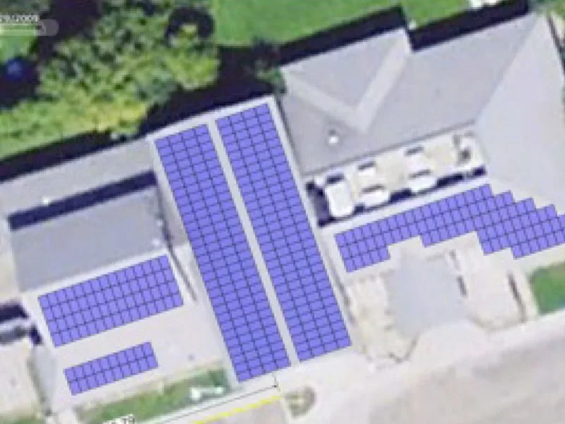 Aerial view of photovoltaic panels on a community or institutional facility roof