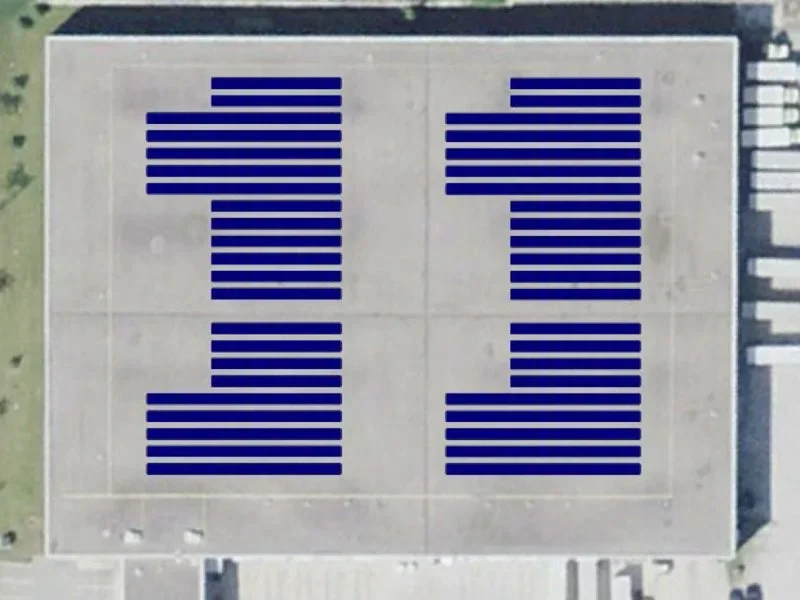 Ordered rows of photovoltaic modules on a broad low-slope roof