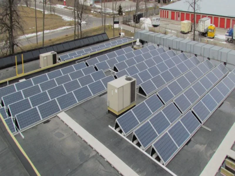 Commercial rooftop solar array arranged around mechanical equipment